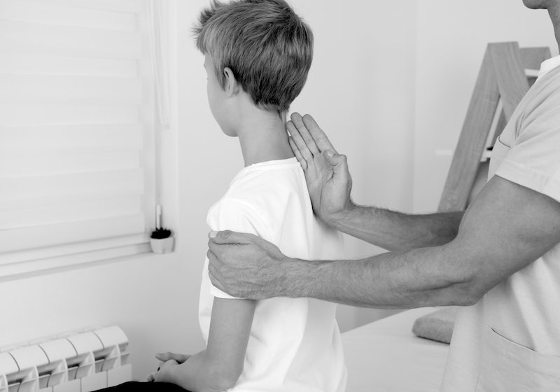 Child in doctor's office to fix posture