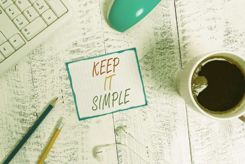 Keep It simple post it sign on an office desk