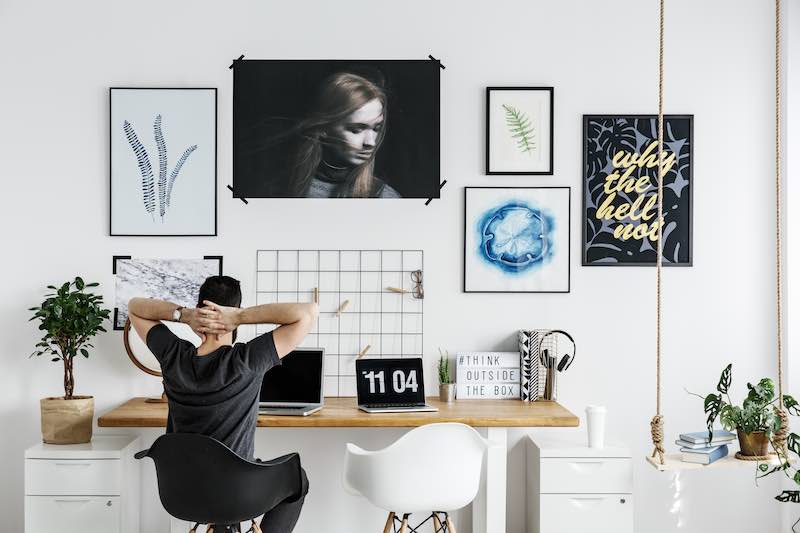 Man working from home at a minimalist office desk