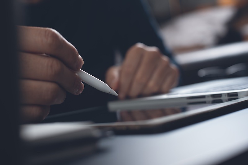 Man using a graphic tablet in a paperless office