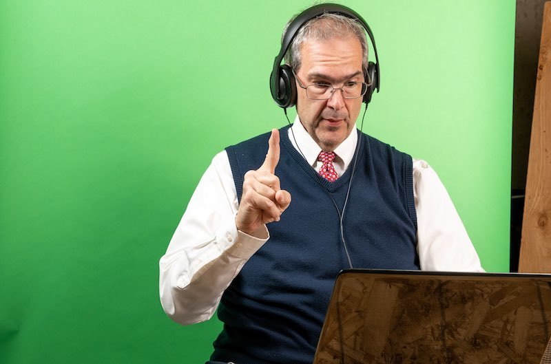 Man working from home in his basement on a virtual meeting